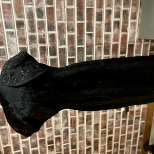 Black beaded gown with bolero jacket.